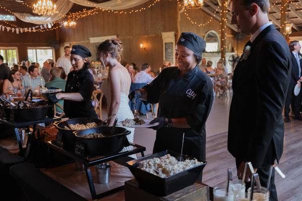 Bride and groom being served