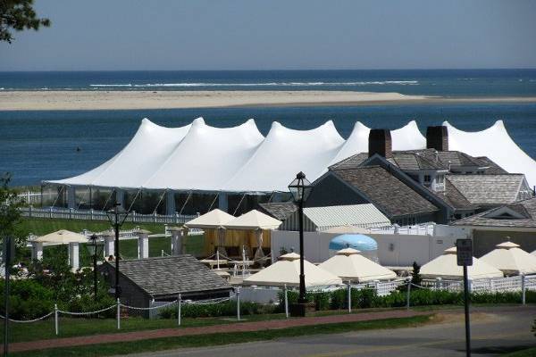 20'x70' Navi-Trac frame tent with a clear tent top.