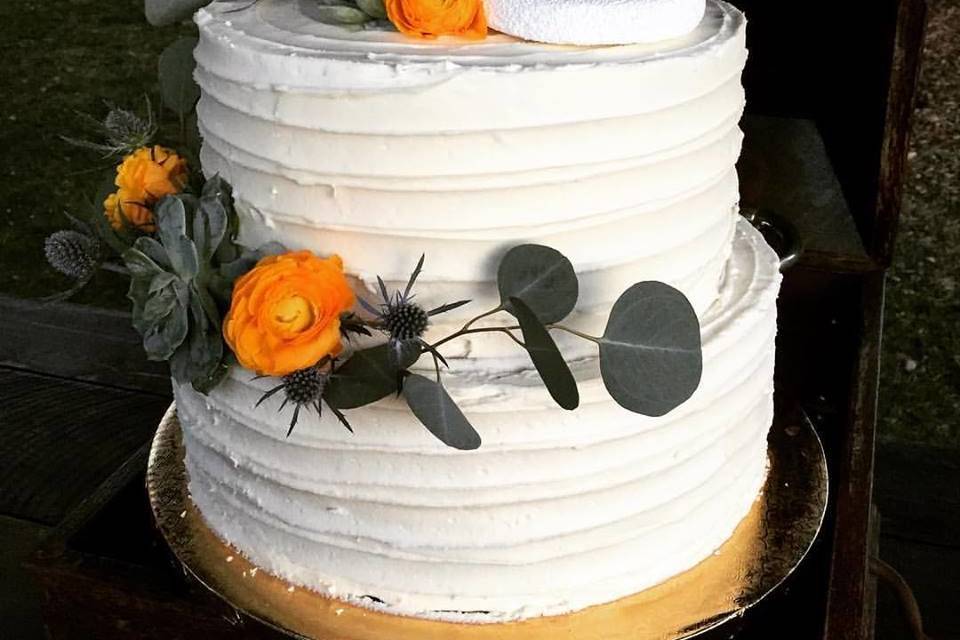 Orange flowers on a wedding cake