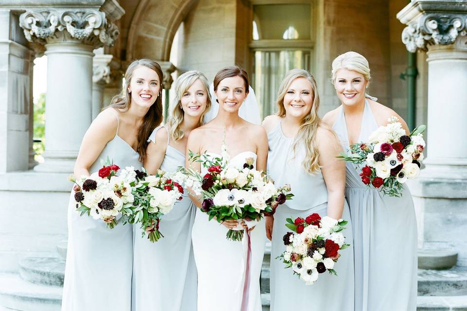 Excited bridal team with blooms