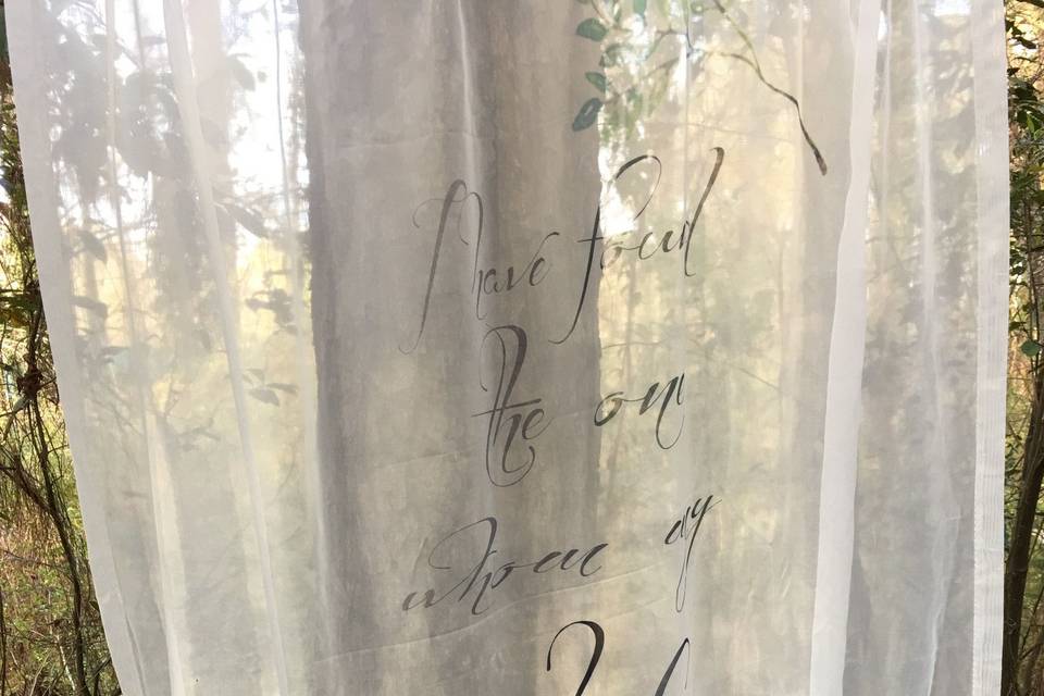 Hand lettered sheer panel.   Wonderful and whispy.   Can create a mood in an instant.  Use with a series of other sheers for back drops or by itself.   Any customized lettering can be used on a sheer or an opaque back drop