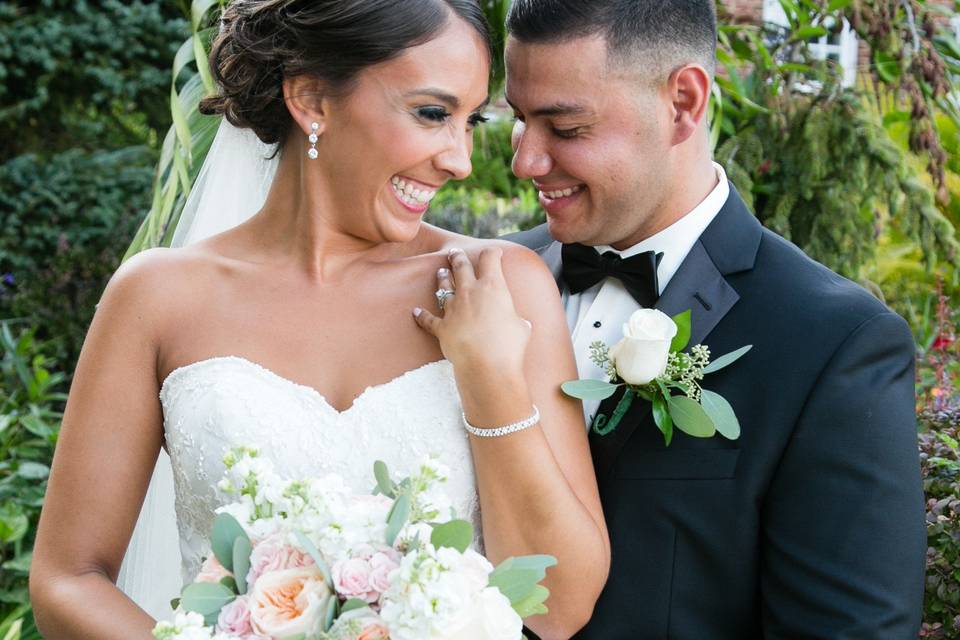 A laughing bride and groom