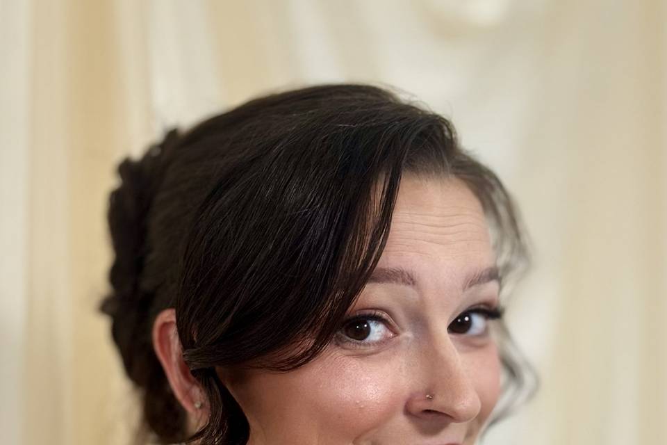 Romantic updo and sculpted gla