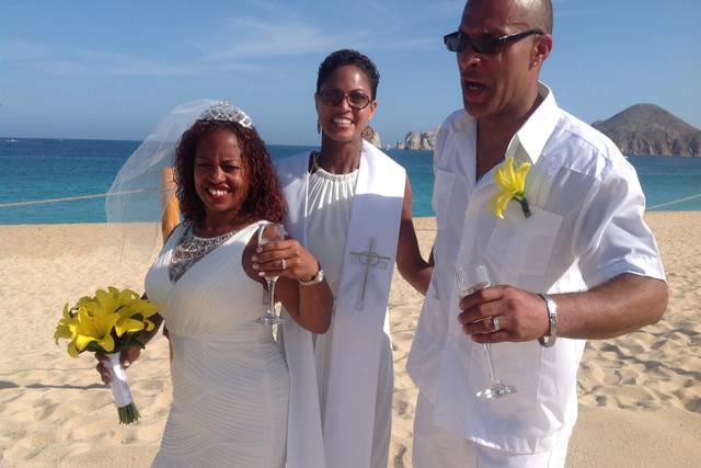 The officiant getting the Happy Couple into position.