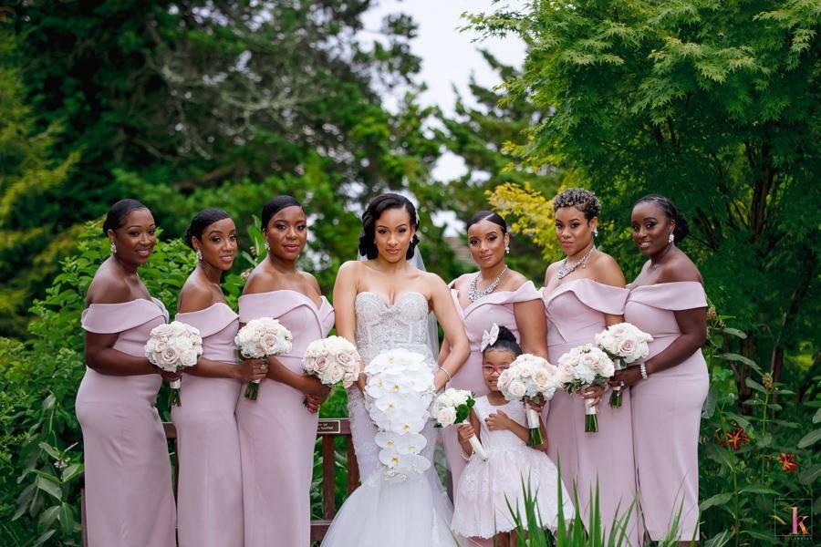 Bride and bridesmaids strike a pose