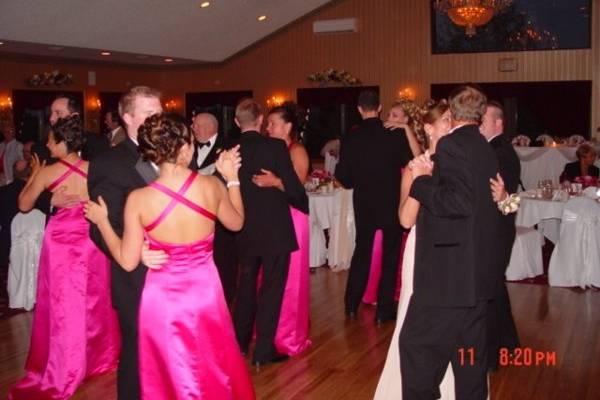 The couple with their guests dancing