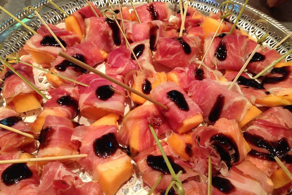 Prosciutto wrapped Local Melon with Balsamic Reductiion