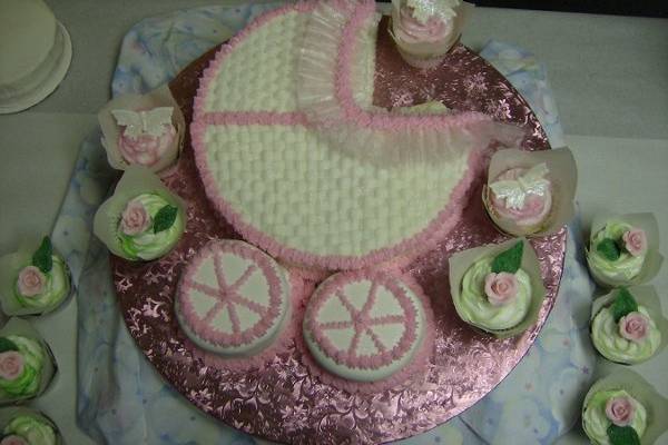 Baby shower cake with cupcakes.