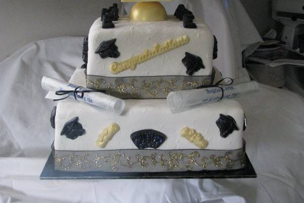 Grad cake with edible diplomas.