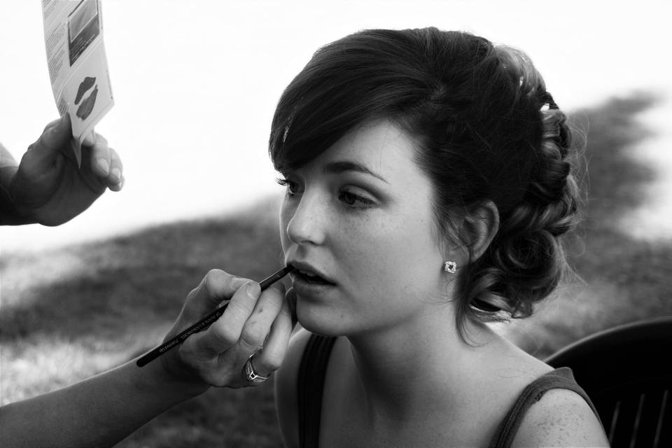 A bride getting her makeup done.