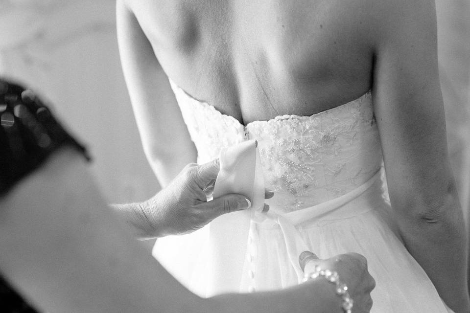 Buttoning the dress!
