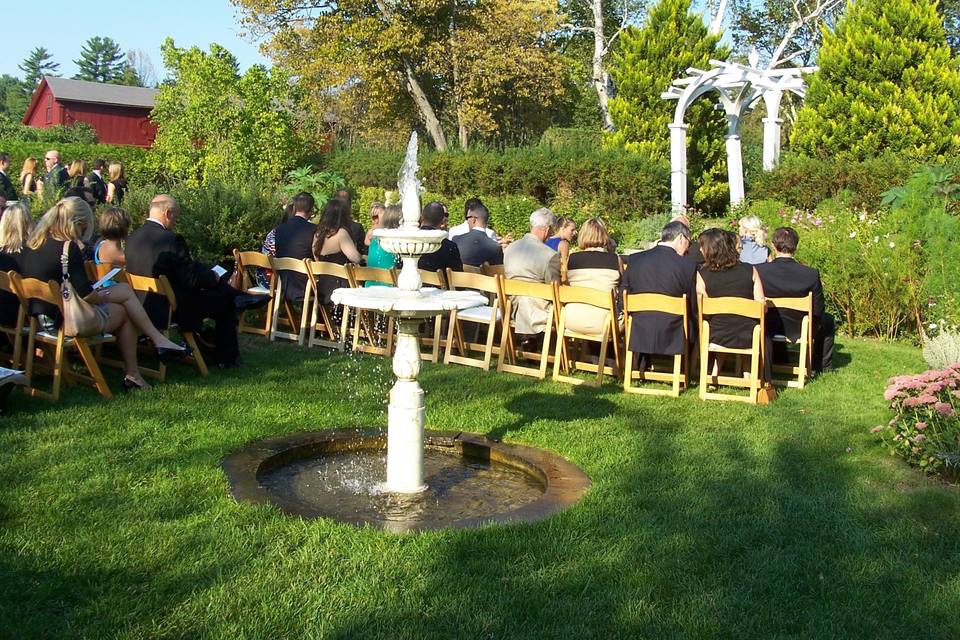 Garden wedding ceremony with fountain