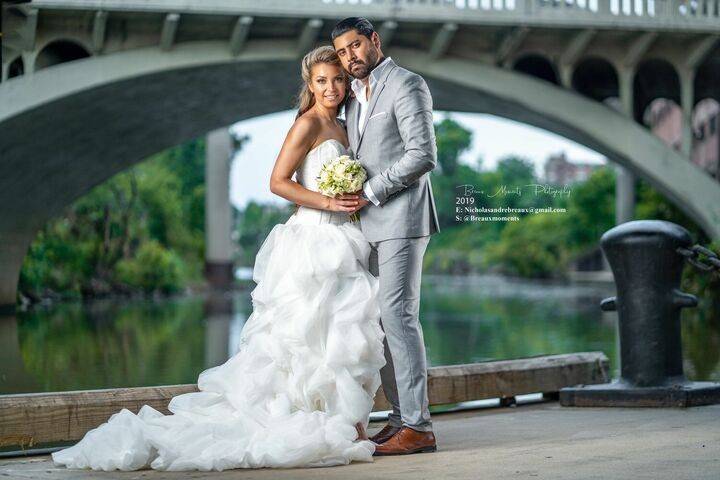 Happy couple by the water - Breaux Moments Photography
