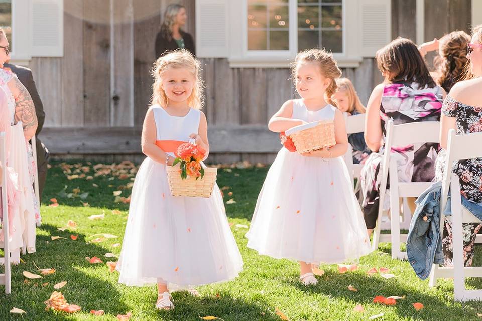 Flower girls walking down the aisle