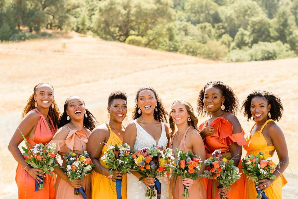 Vibrant bridesmaids with bouquets