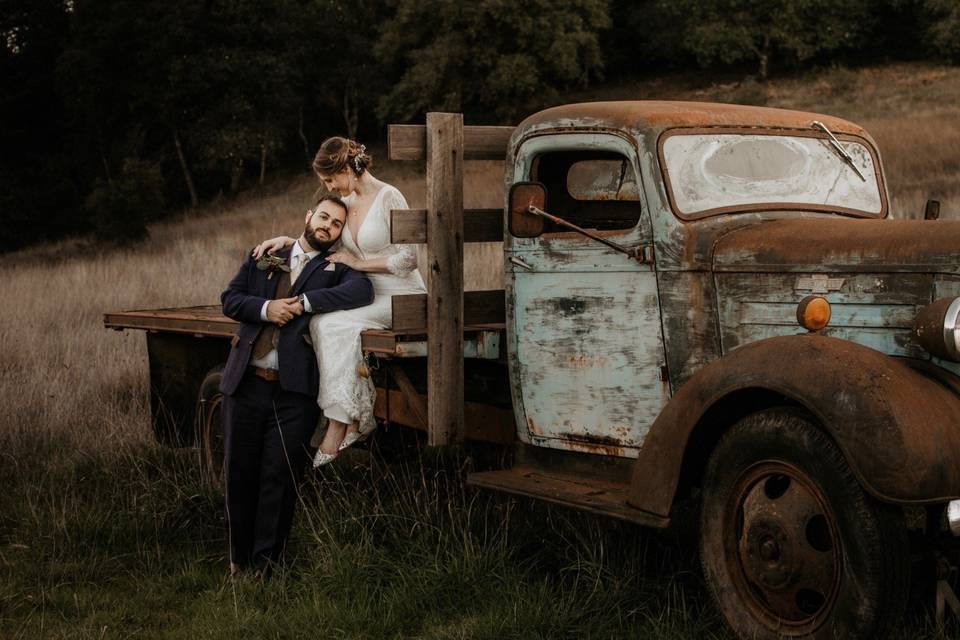 Couple posing on vintage truck