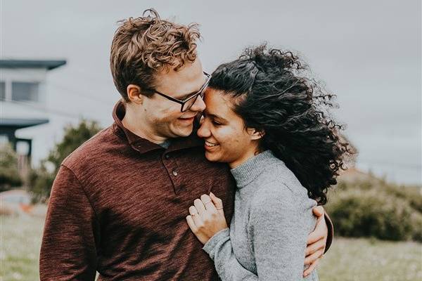 Newly engaged couple share a moment