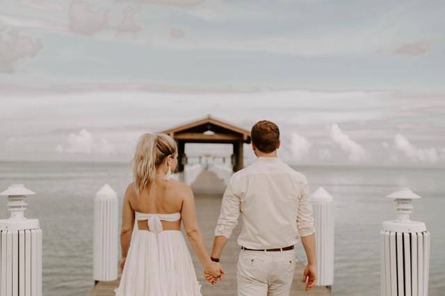 Newlyweds walking down the dock