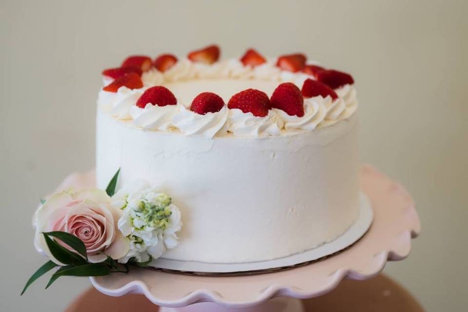 Textured buttercream almond cake placed on a gorgeous cake stand (Photo Credit Shauntell Gull Photography, Cake Stand Sweet Carolina Collective)