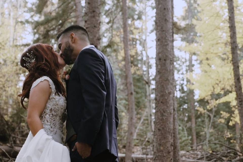 Couple standing in forest