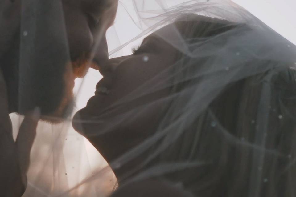 Couple behind veil