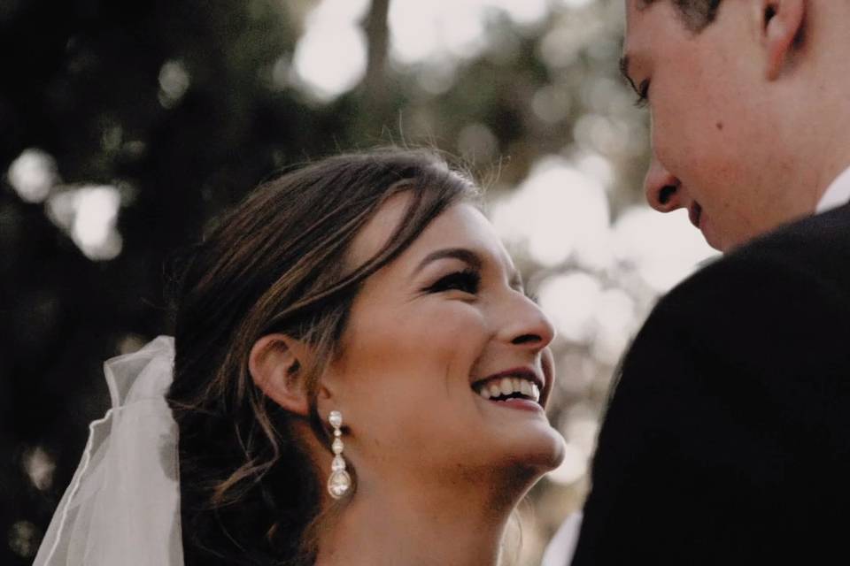 Bride laughing with groom