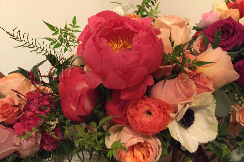 Gorgeous Bridal Bouquet with coral mango peach shades & the beautiful white anemone peaking through.