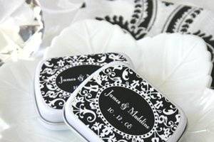 These retro chic Damask Tins can show off your hip and modern style. Guests can easily slip them into their pocket or purse. You can choose the color on the label to match the scheme of your wedding.
Tins come personalized with your names and message OR they can be printed with your 3 letter Monogram (please choose one option or the other). MINTS ARE NOT INCLUDED