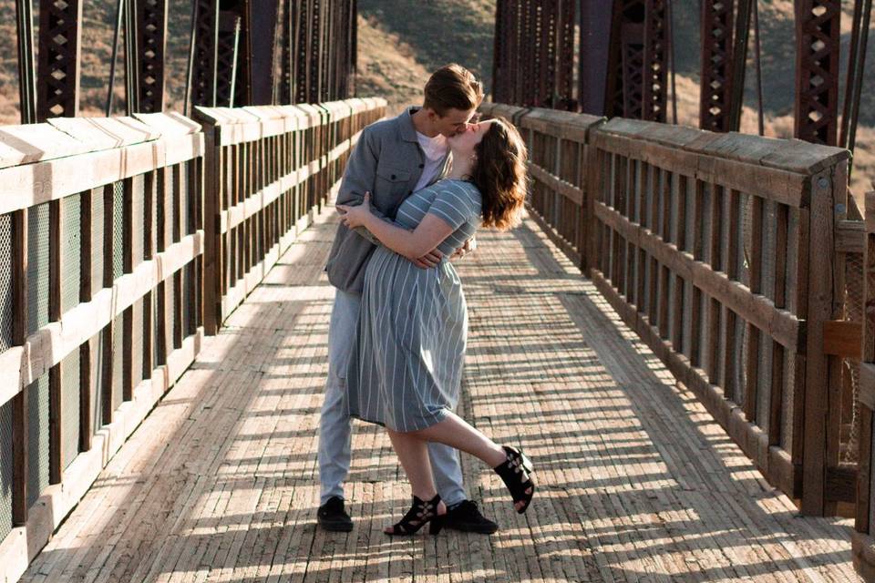 Kissing on a bridge