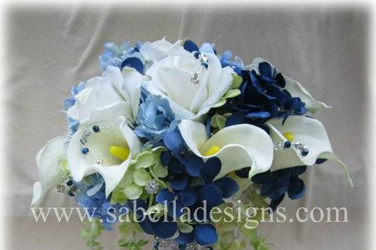 Beautiful Brides bouquet consisting of high quality Real Touch roses, calla lillies, orchids, & hydrangea with rhinestone and Swarovski crystals accents throughout.