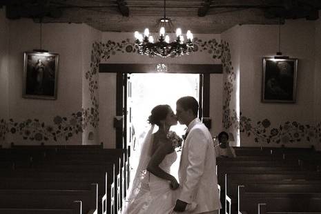 Stealing a kiss after the ceremony. San Luis Obispo Mission, San Luis, California