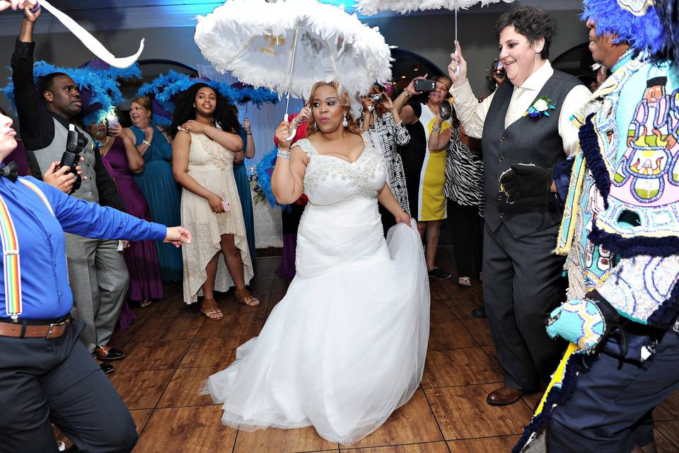 Couple dancing with their guests