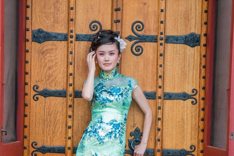 A Chinese bride wearing traditional Cheongsam  wedding dress. ©2018 Fort Point Media LLC, All Rights Reserved.