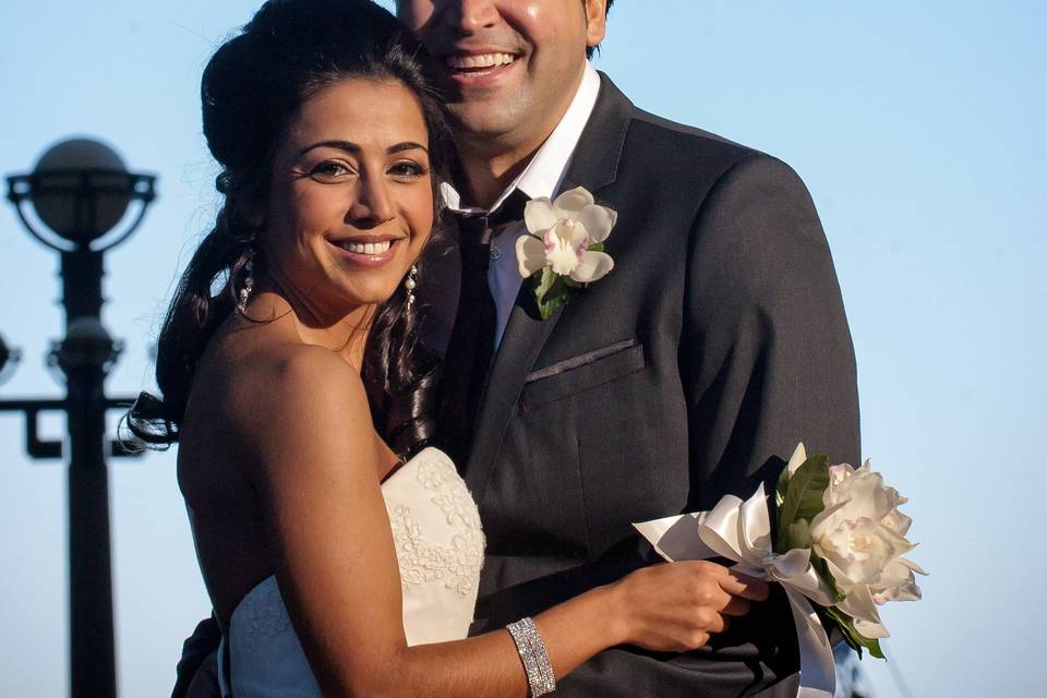 Portrait of Greek groom and Persian bride with moon backdrop at Boston Harbor Hotel wedding. ©2018 Fort Point Media LLC, All Rights Reserved.