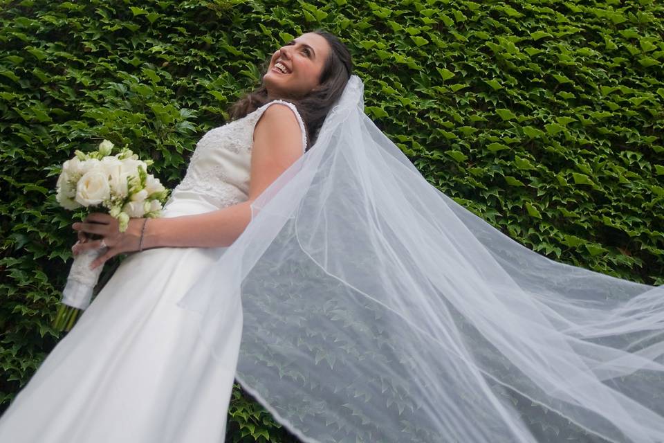 Bride with flowing veil beside ivy wall on Granby St. at Boston University. ©2018 Fort Point Media LLC, All Rights Reserved.