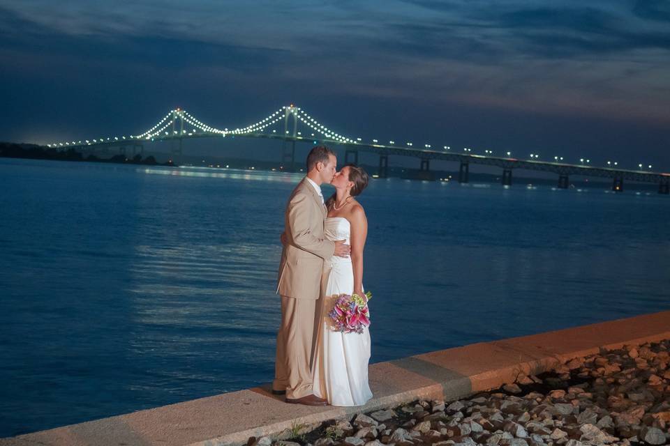 Wedding kiss with the Pell Newport Bridge as a backdrop. ©2018 Fort Point Media LLC, All Rights Reserved.