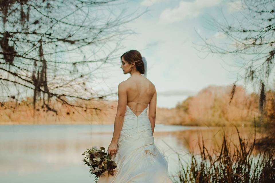 Bride beside lake