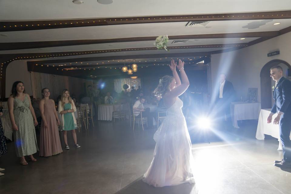 Bouquet toss by Two Guys Photo