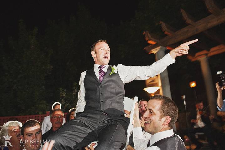 A groom on a chair in the air