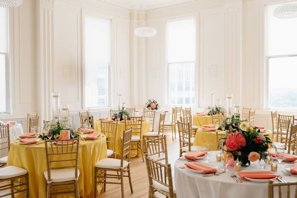 Yellow and white round table setup