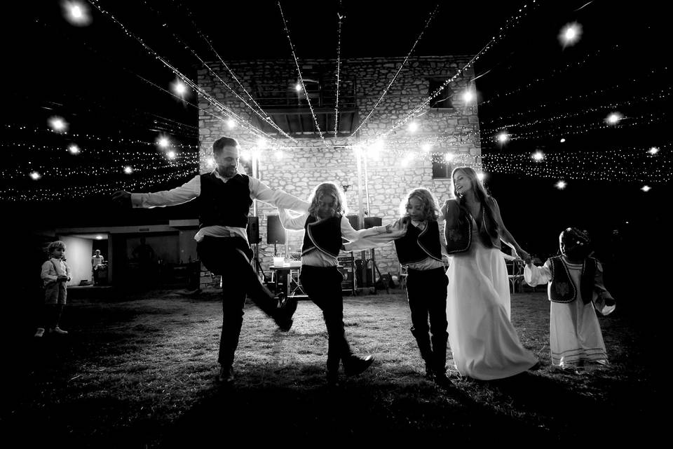 Dance under string lights sky