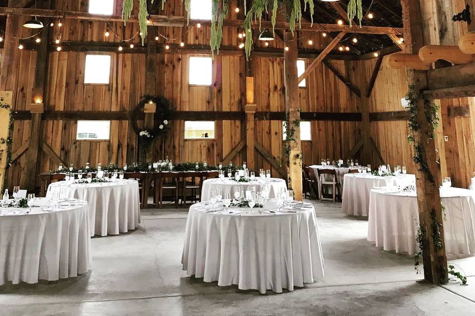 Barn wedding meets classic elegance!  Our white tablecloths look gorgeous in this setting, don't you agree?  Why rent when you can buy these linens from Smarty Had A Party!