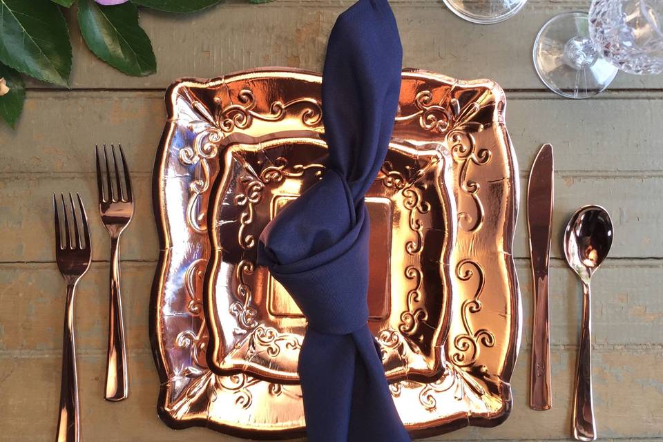 Going for rose gold for your wedding?  These gorgeous pieces are all disposable!  Wait...no...that napkin isn't!  Look at that royal blue!  That's our blue polyester napkin.  Those glasses?  Yeah, they're plastic and they're made to look just like cut glass - gorgeous!