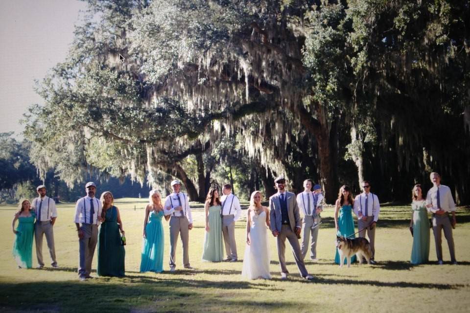 The couple with the bridesmaids and groomsmen