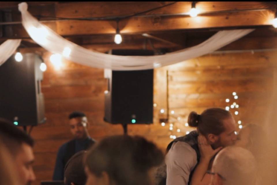 Wedding couple stealing kisses