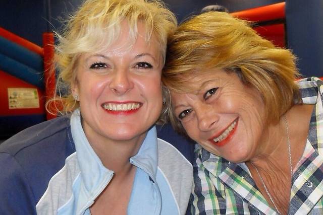 Beaming mother and daughter