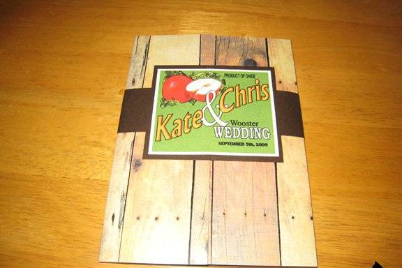 Barnwood-patterned gatefold with custom vintage fruit label inspired seal.