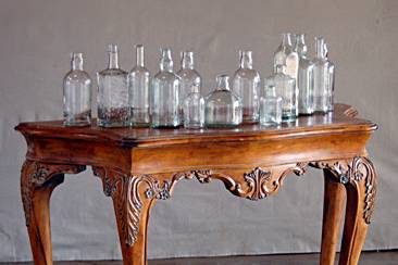Llewellyn Table and Large Clear Apothecary Bottles