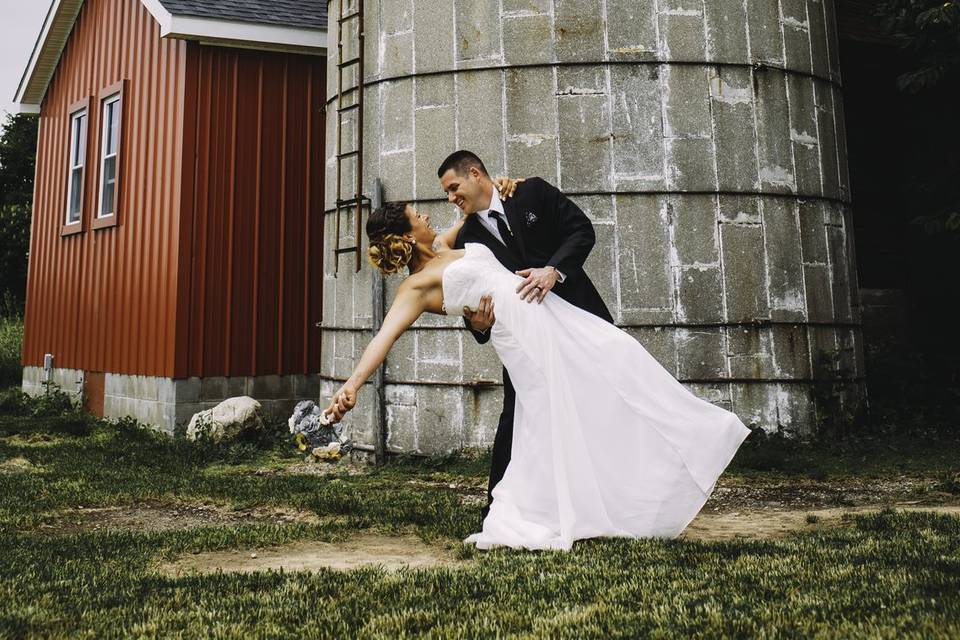 Groom dips his bride