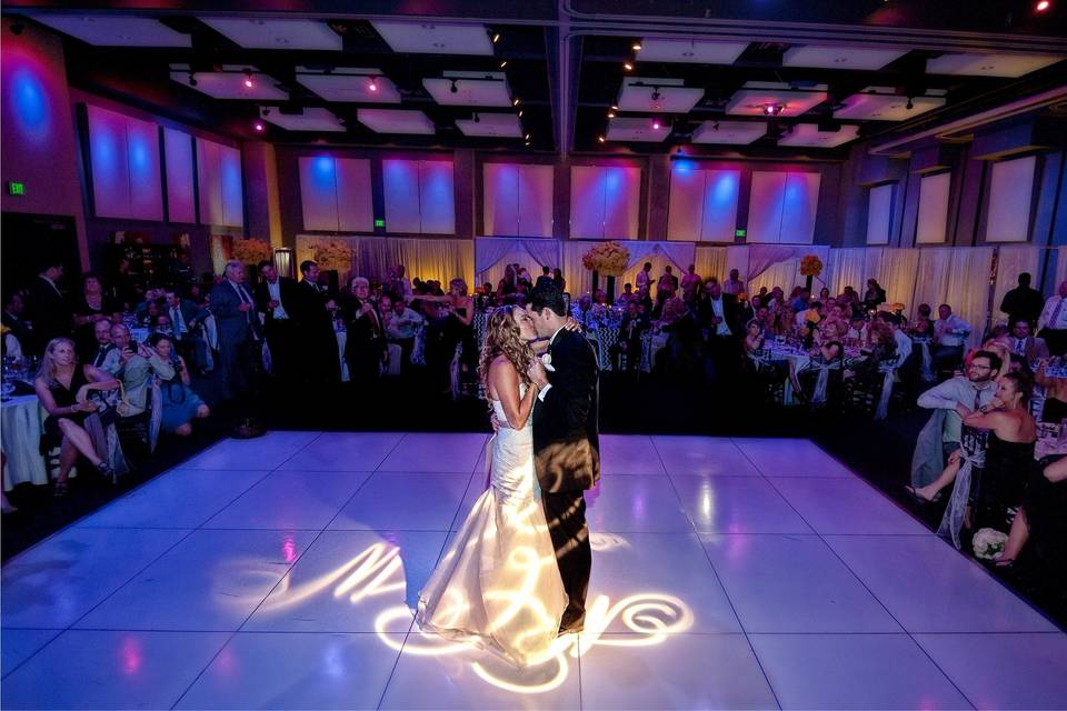 Newlyweds kissing on the dance floor